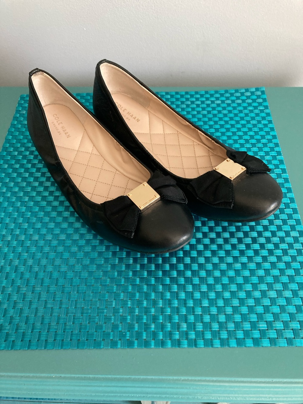 Cole Haan Black Leather Bow Flats with Gold Plaque